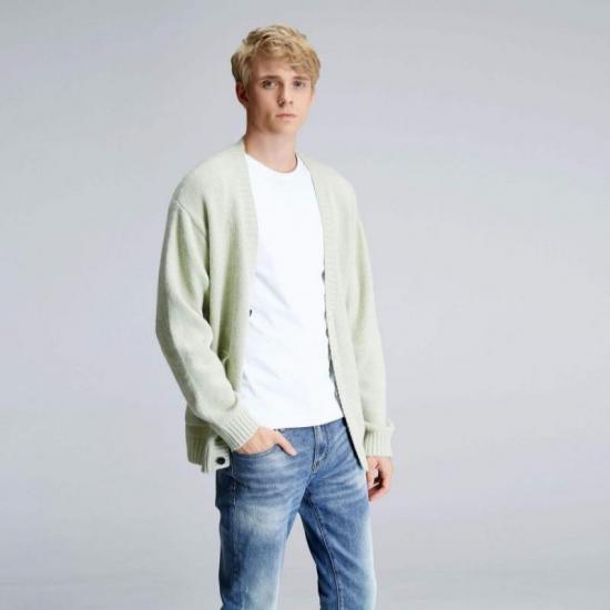 Man wearing light green open cardigan outfit